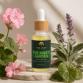 Bottle of 'The King's Garden' dry body oil with flowers and plants on a neutral background