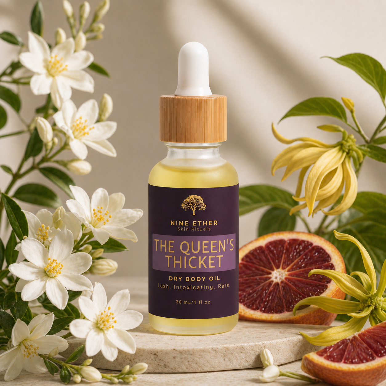 Bottle of 'The Queen's Thicket' dry body oil with flowers and fruits on a wooden surface